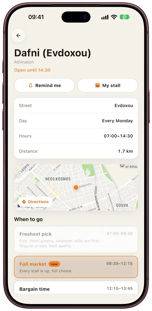 App screen: a market's street and hours, with a notice that it moved